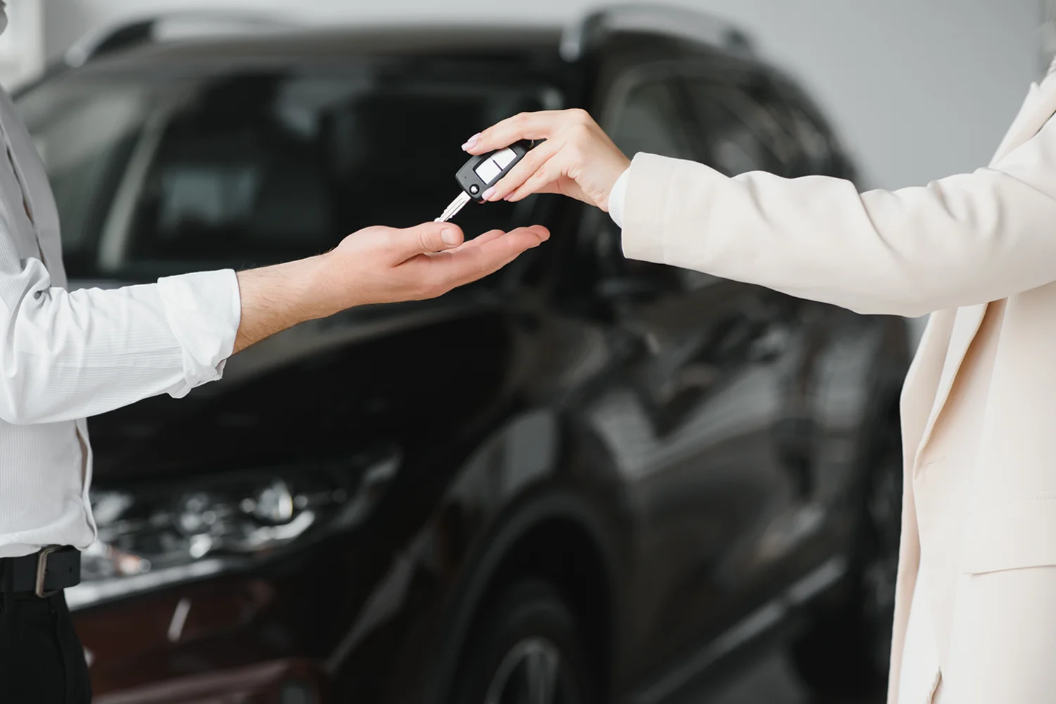 Handing keys to Auto Freight Client handing car keys to car transport company