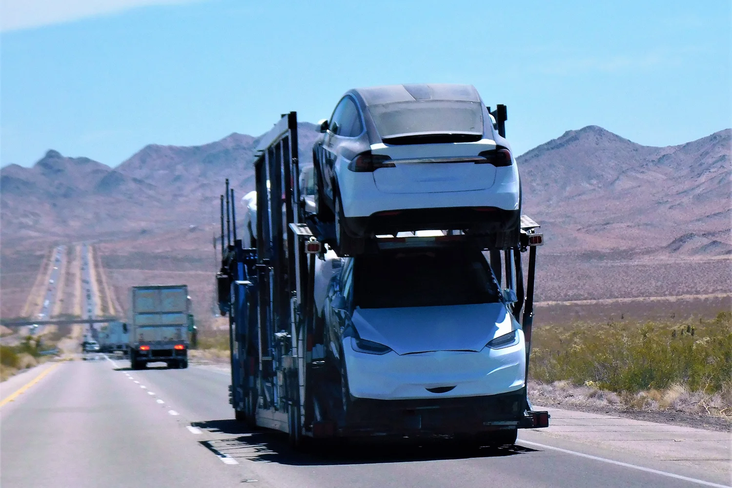 On the road car transport landscape Car Trailer hitting the road while carrying cars